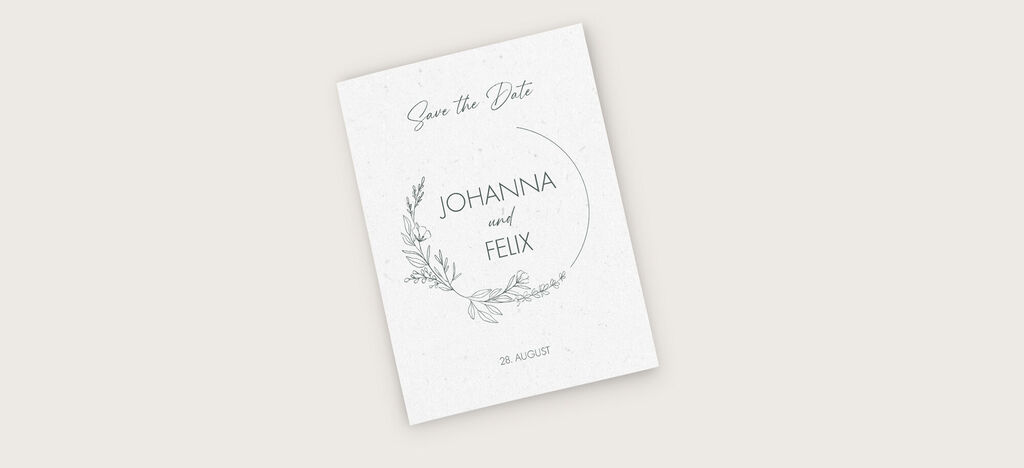 Ein Save-the-Date-Kartenmotiv für Johannes und Felix mit floralen Akzenten und elegantem Text.
