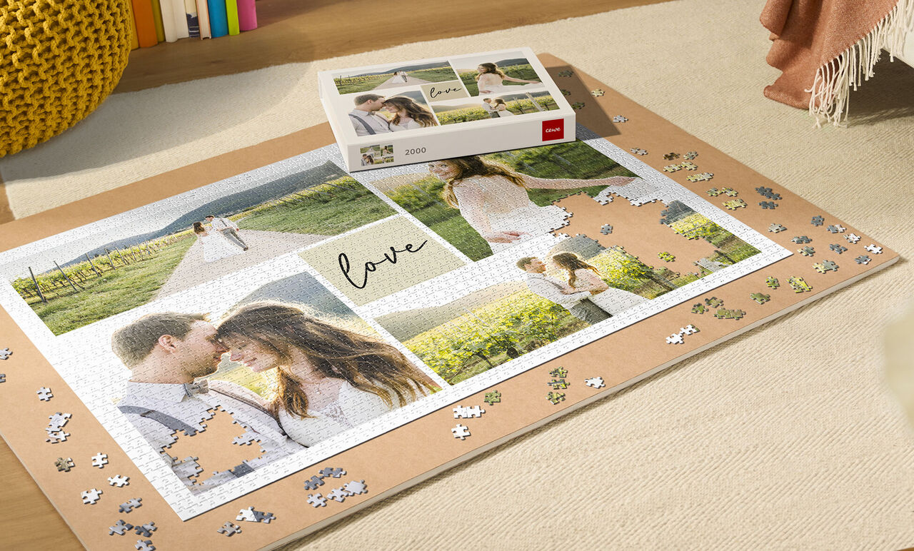 Eine kreative Fotocollage mit dem Titel 'love'. Sie zeigt glückliche Momente eines Paares in einer natürlichen Umgebung. Daneben liegt ein CEWE FOTOBUCH zur Gestaltung. Puzzle-Teile sind im Vordergrund.