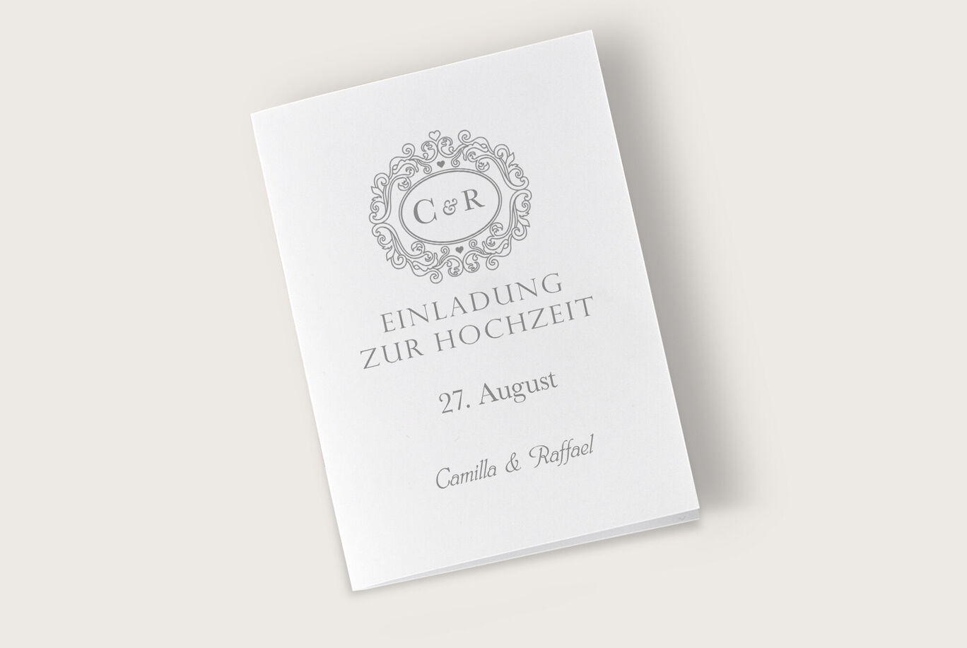 Einladungskarte zur Hochzeit mit monogrammierten Initialen C & R, Datum und Namen.
