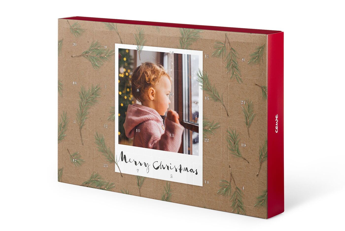Ein Weihnachtskalender mit festlichem Design und einem Foto. Der Kalender ist verziert mit Tannenzweigen und hat die Aufschrift 'Merry Christmas'.